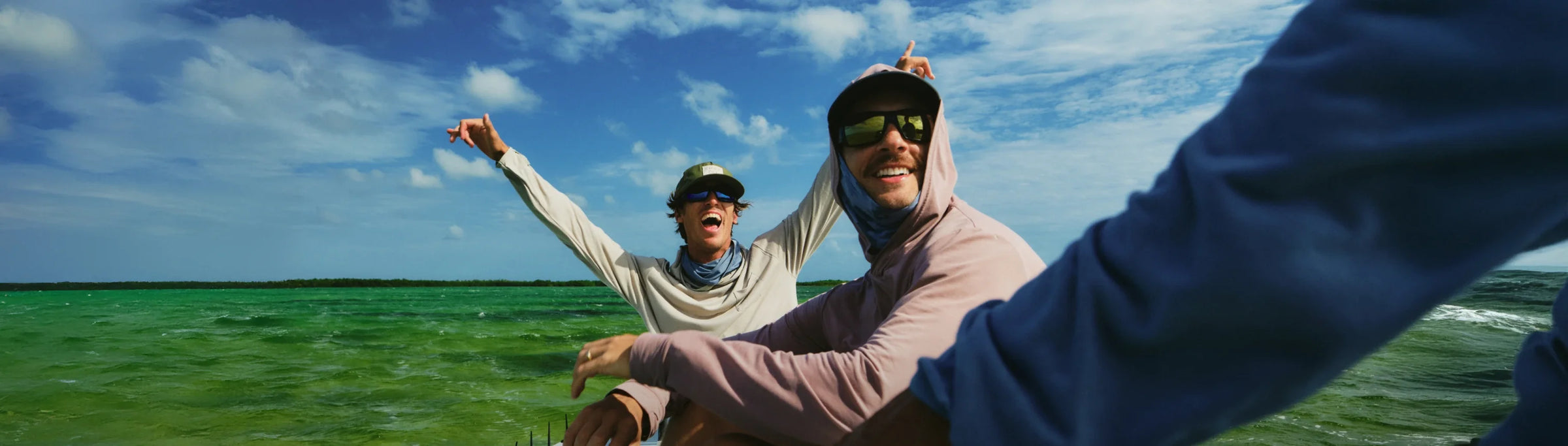 Guys on boat celebrating