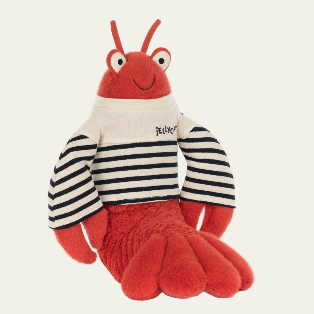 Red lobster plush toy wearing white and navy stripe sweater with "Jellycat" brand label